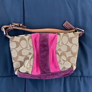 Vintage pink and purple suede coach handbag .